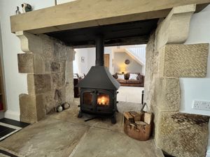 Inglenook with double sided stove- click for photo gallery